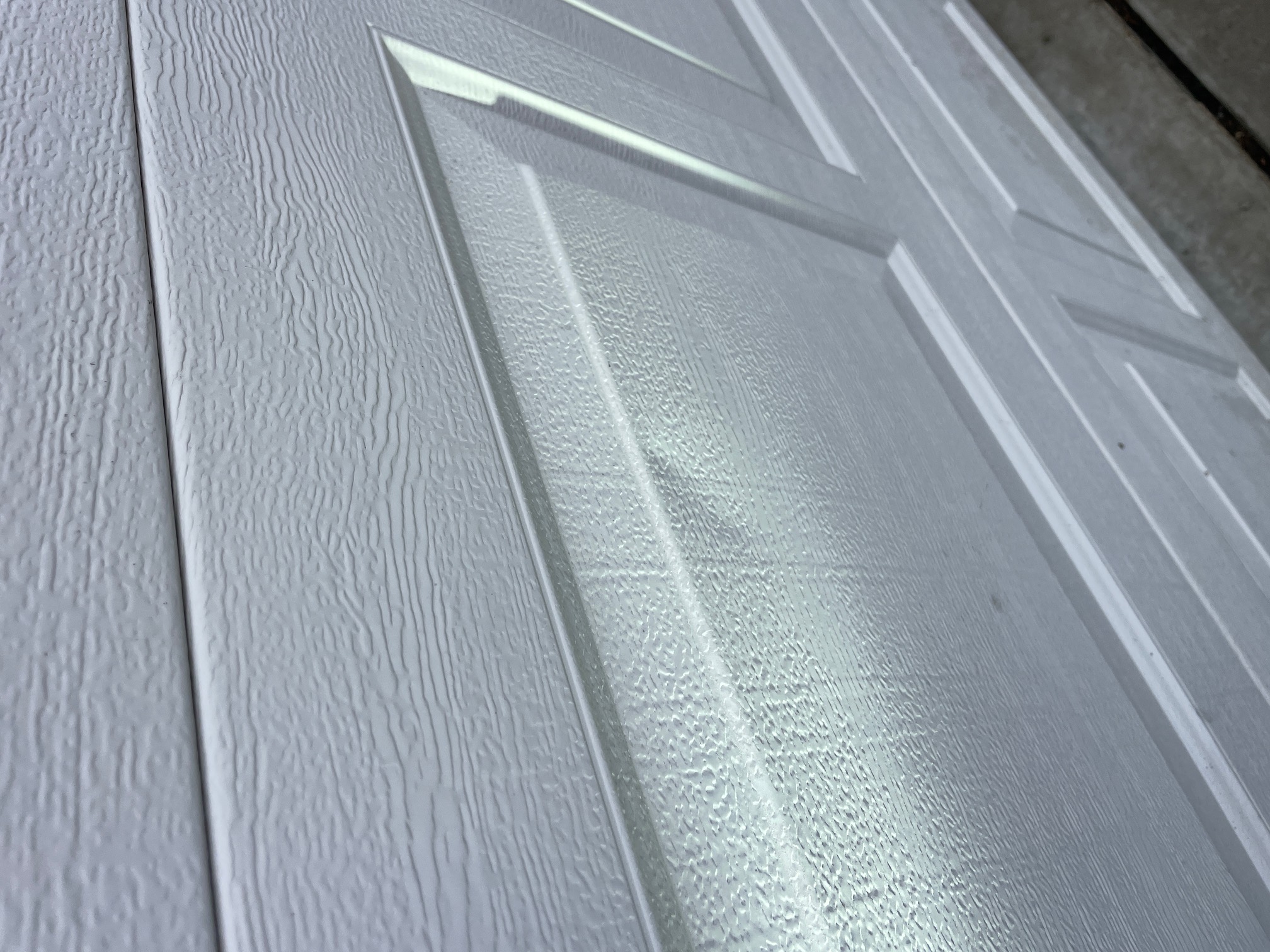 Hail damage on garage door